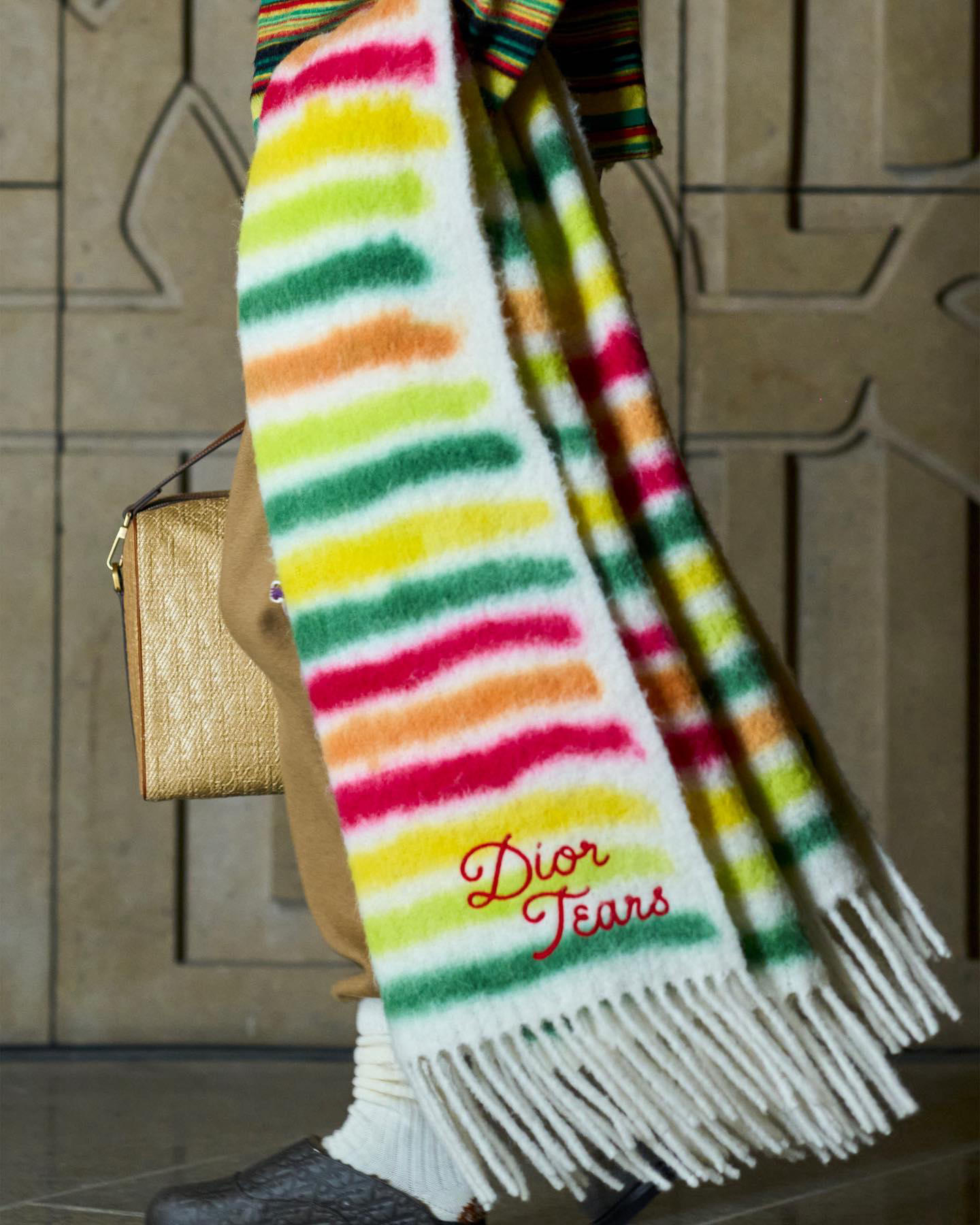 image  1 Dior Official - Painterly striped scarves and crocheted hats, and the logoed embroideries of the cot